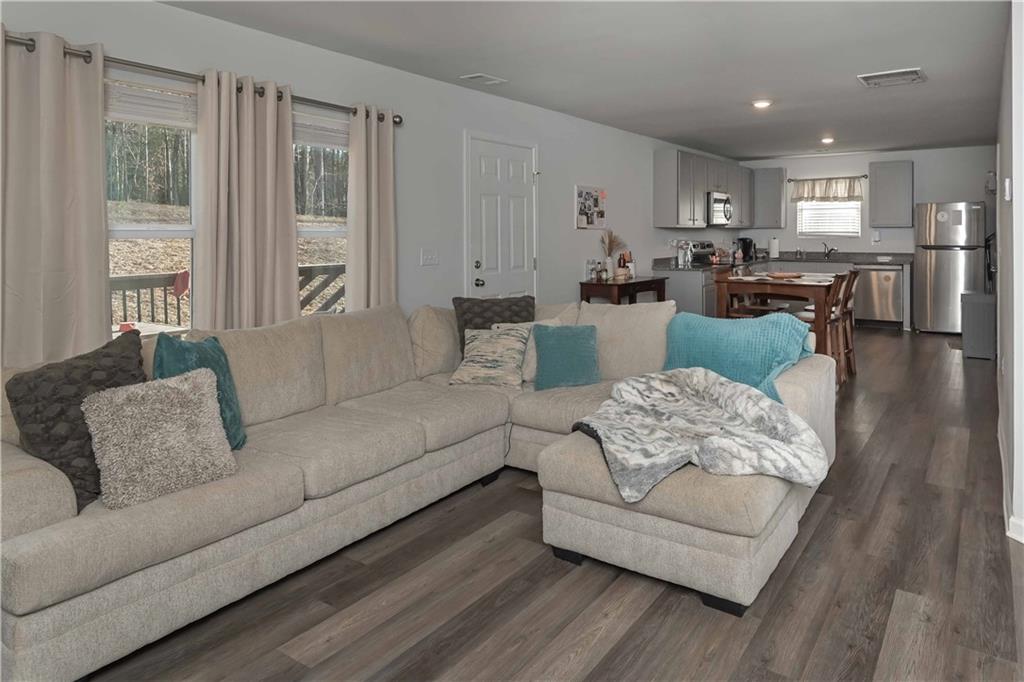 294 Muskogee Drive Dallas, GA 30132 - Photo 12 of 32 a living room with furniture and kitchen view