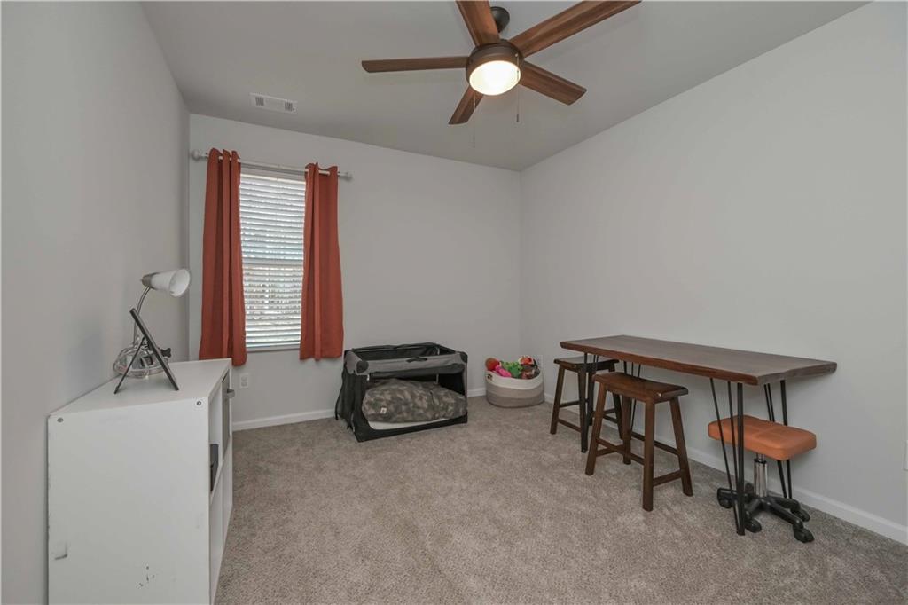 294 Muskogee Drive Dallas, GA 30132 - Photo 24 of 32 a bedroom with furniture and a window