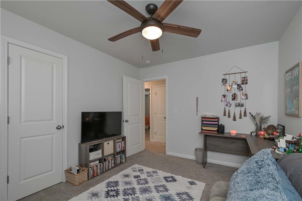 294 Muskogee Drive Dallas, GA 30132 - Photo 27 of 32 a living room with furniture and a flat screen tv