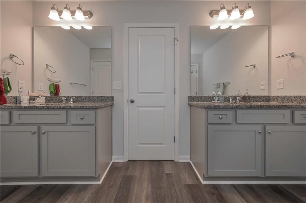 294 Muskogee Drive Dallas, GA 30132 - Photo 30 of 32 a kitchen with a sink a mirror and a vanity