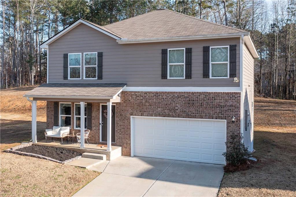 294 Muskogee Drive Dallas, GA 30132 - Photo 3 of 32 a front view of a house with garden