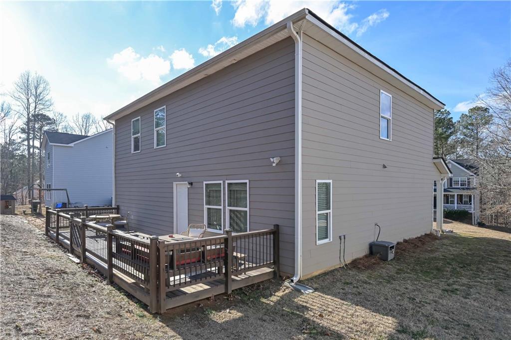 294 Muskogee Drive Dallas, GA 30132 - Photo 6 of 32 a view of house with backyard and deck