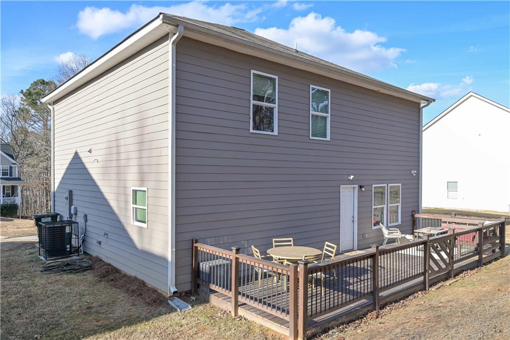294 Muskogee Drive Dallas, GA 30132 - Photo 8 of 32 a brick house with large windows