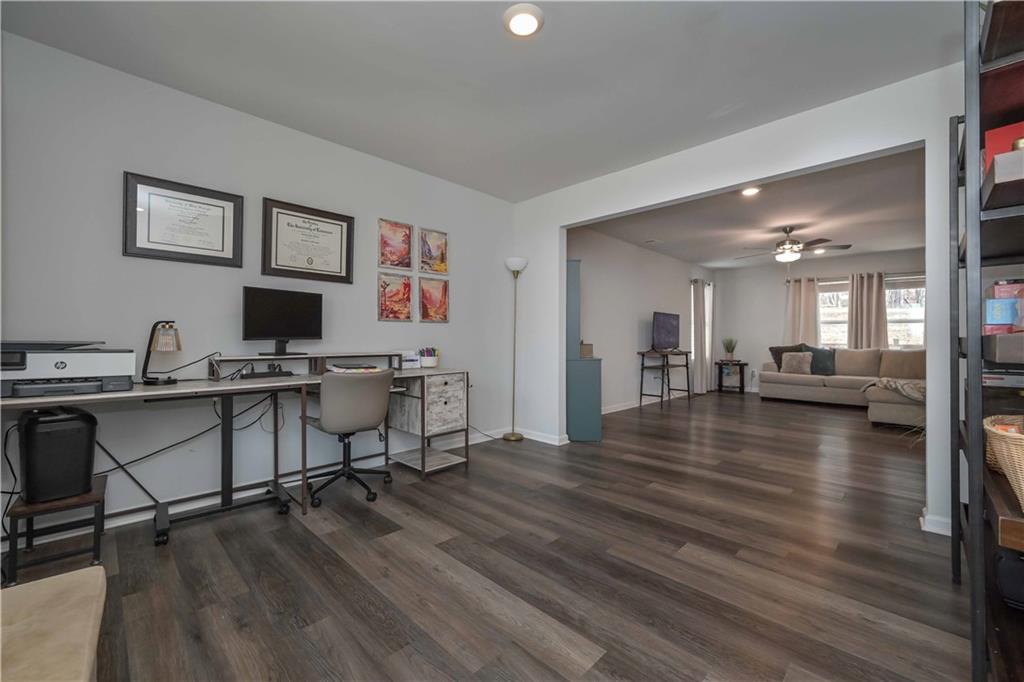 294 Muskogee Drive Dallas, GA 30132 - Photo 9 of 32 a view of a livingroom with workspace and hardwood floor