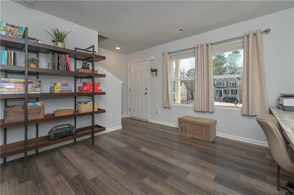 294 Muskogee Drive Dallas, GA 30132 - Photo 10 of 32 a living room with furniture and a book shelf