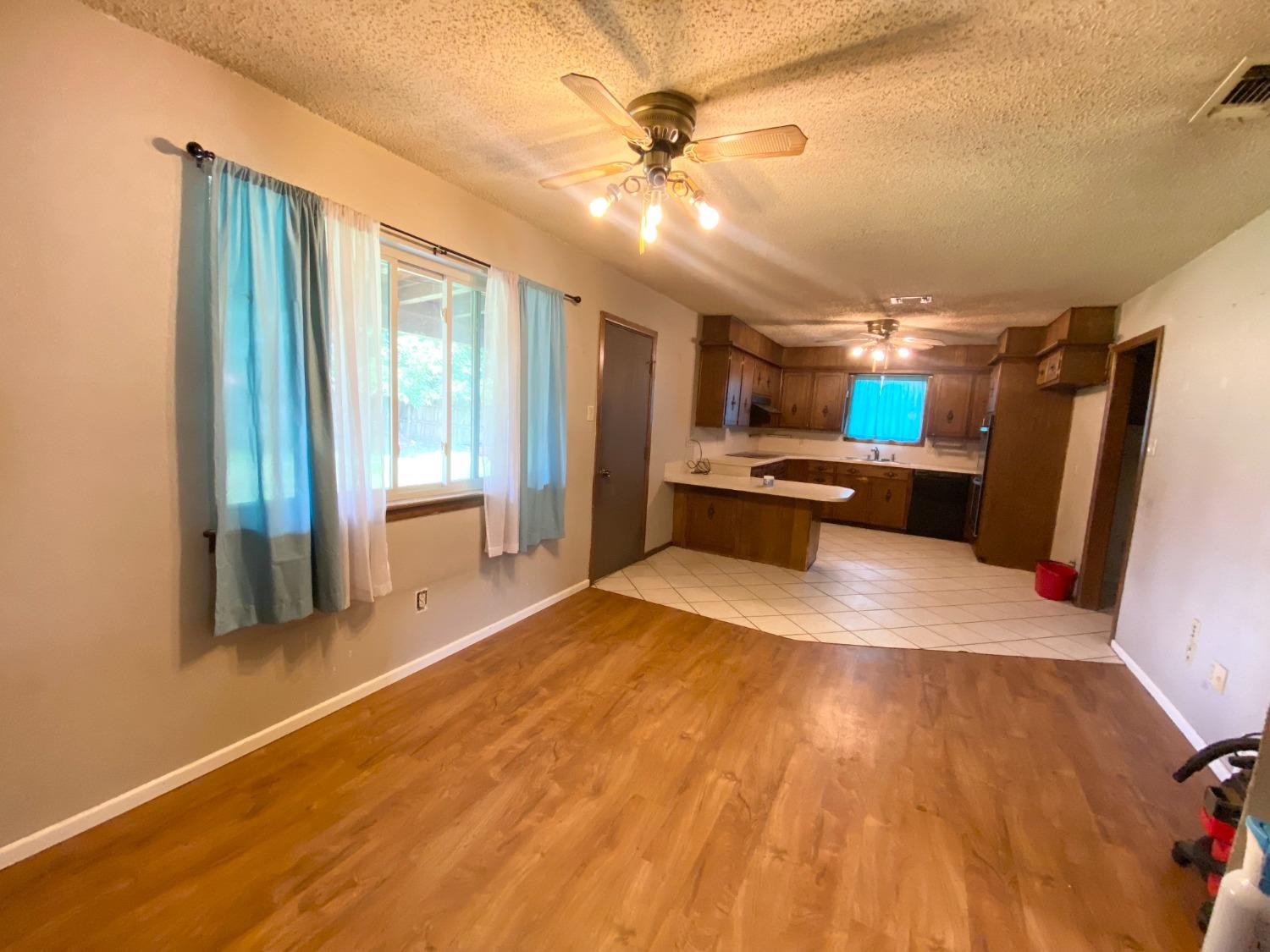 1311 Ave G Abernathy, TX 79311 - Photo 6 of 15 a view of livingroom with kitchen and front door