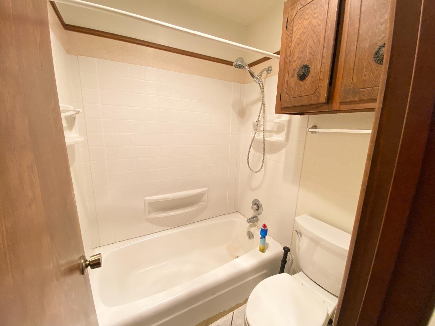 1311 Ave G Abernathy, TX 79311 - Photo 10 of 15 a bathroom with a shower and a toilet