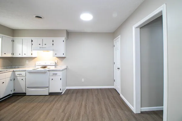 a view of kitchen with wooden floor
