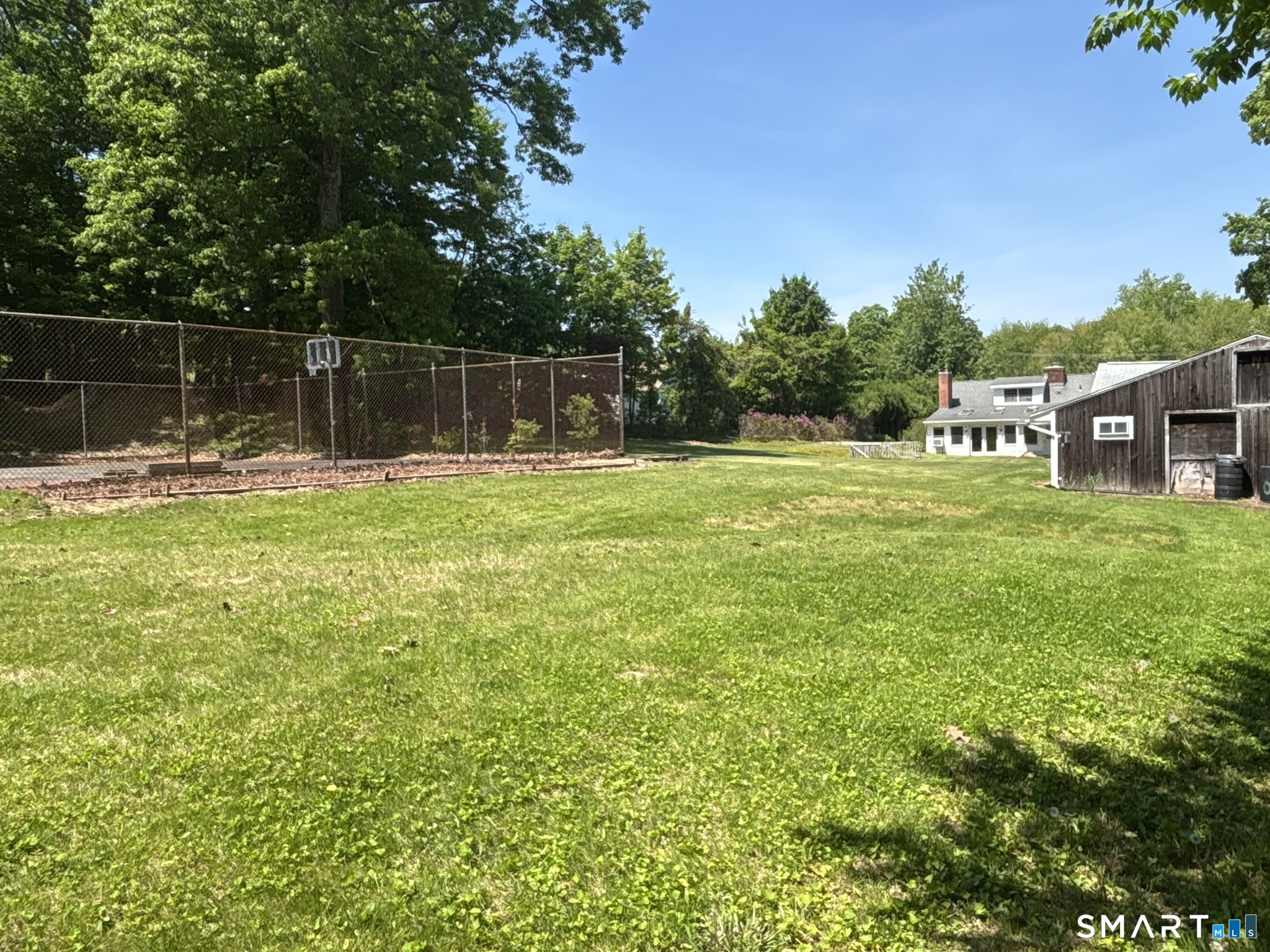 44 Summit Road Prospect, CT 06712 - Photo 35 of 40 a view of a backyard with a garden and trees