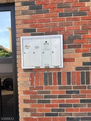 a view of a brick building with wooden floor and windows
