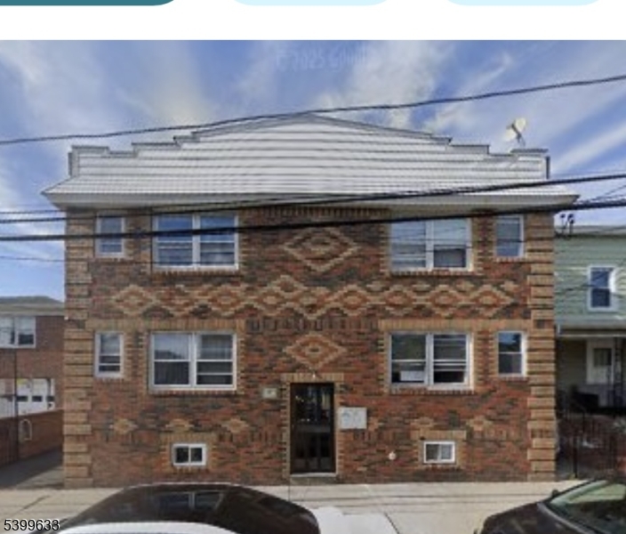 327 Christine Street, Unit 2L Elizabeth, NJ 07202 - Photo 4 of 11 a front view of a building with a brick wall
