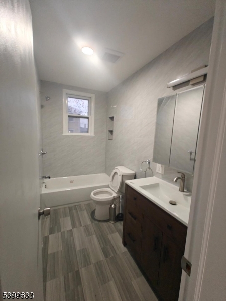 327 Christine Street, Unit 2L Elizabeth, NJ 07202 - Photo 7 of 11 a bathroom with a sink and a mirror