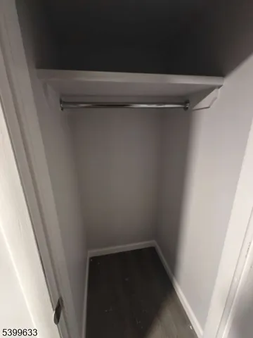 an empty room with wooden floor