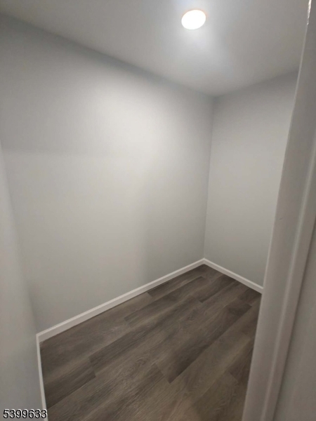 327 Christine Street, Unit 2L Elizabeth, NJ 07202 - Photo 10 of 11 an empty room with wooden floor