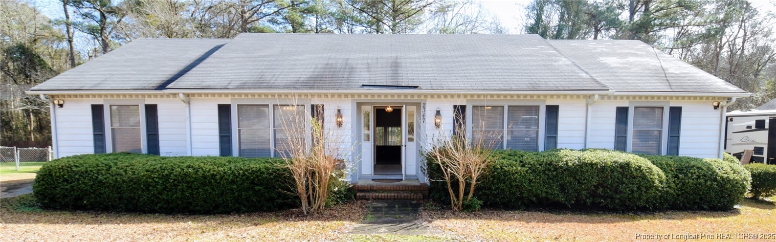 2347 Rolling Hill Road Fayetteville, NC 28304 - Photo 1 of 26 a view of a house with potted plants and large trees