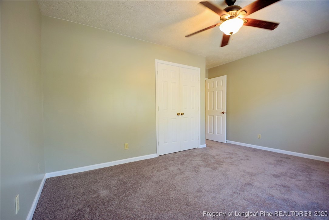 2347 Rolling Hill Road Fayetteville, NC 28304 - Photo 15 of 26 an empty room with a fan and a fan