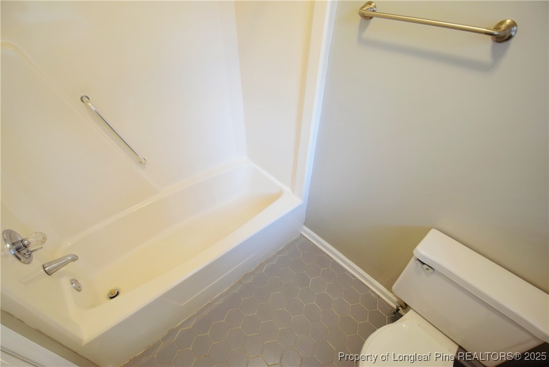2347 Rolling Hill Road Fayetteville, NC 28304 - Photo 21 of 26 a bathroom with a bathtub and toilet