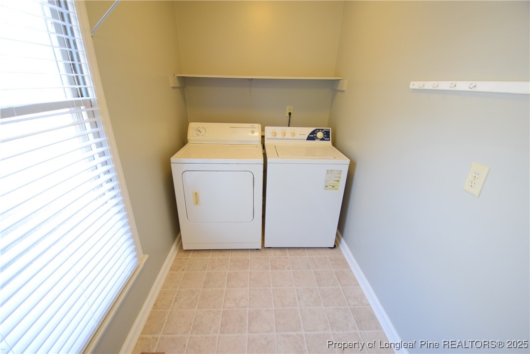 2347 Rolling Hill Road Fayetteville, NC 28304 - Photo 23 of 26 a utility room with dryer and washer