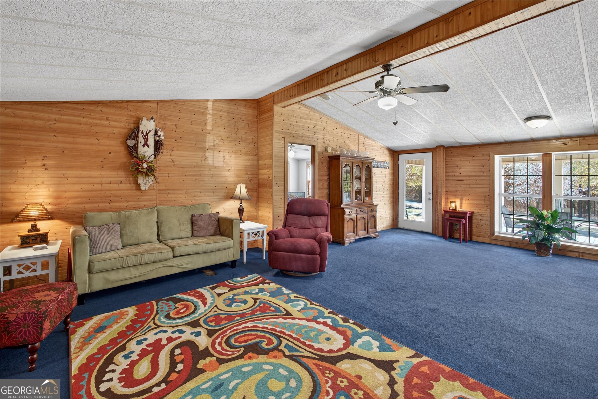 395 Winchester Road Sylvania, GA 30467 - Photo 12 of 60 a living room with furniture and floor to ceiling window