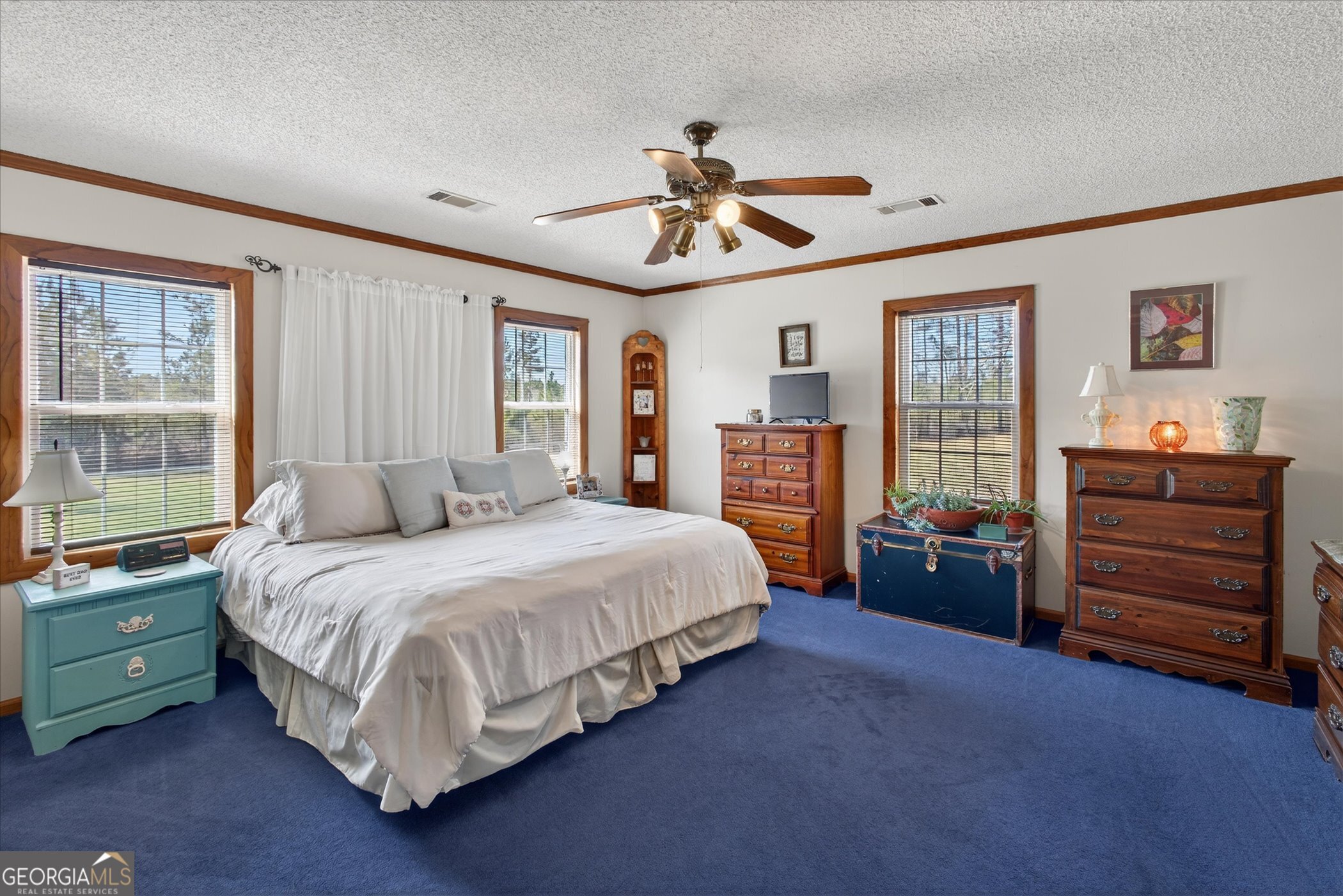 395 Winchester Road Sylvania, GA 30467 - Photo 28 of 60 a bedroom with a bed and wooden floor
