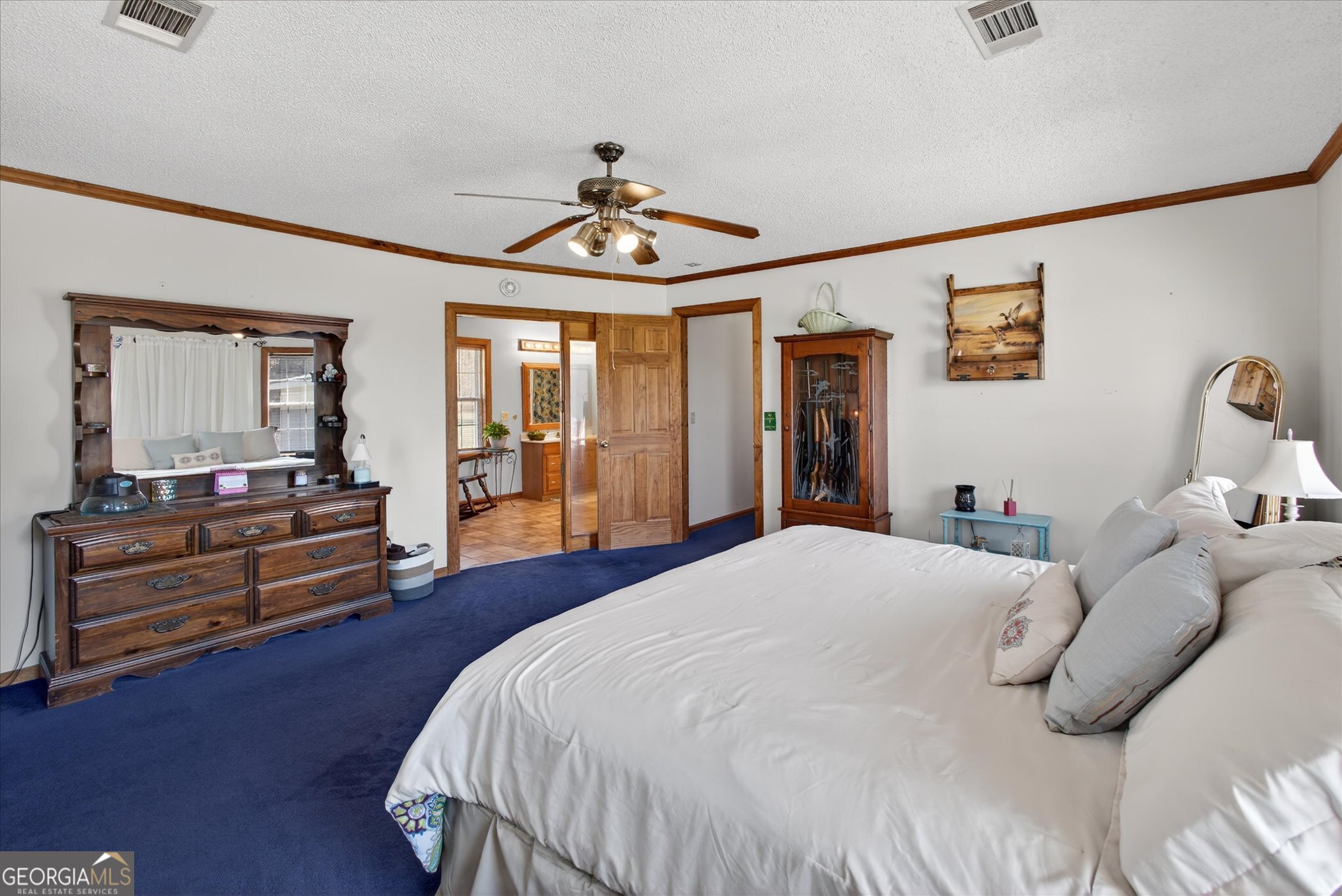 395 Winchester Road Sylvania, GA 30467 - Photo 29 of 60 a bedroom with a bed and wooden floor