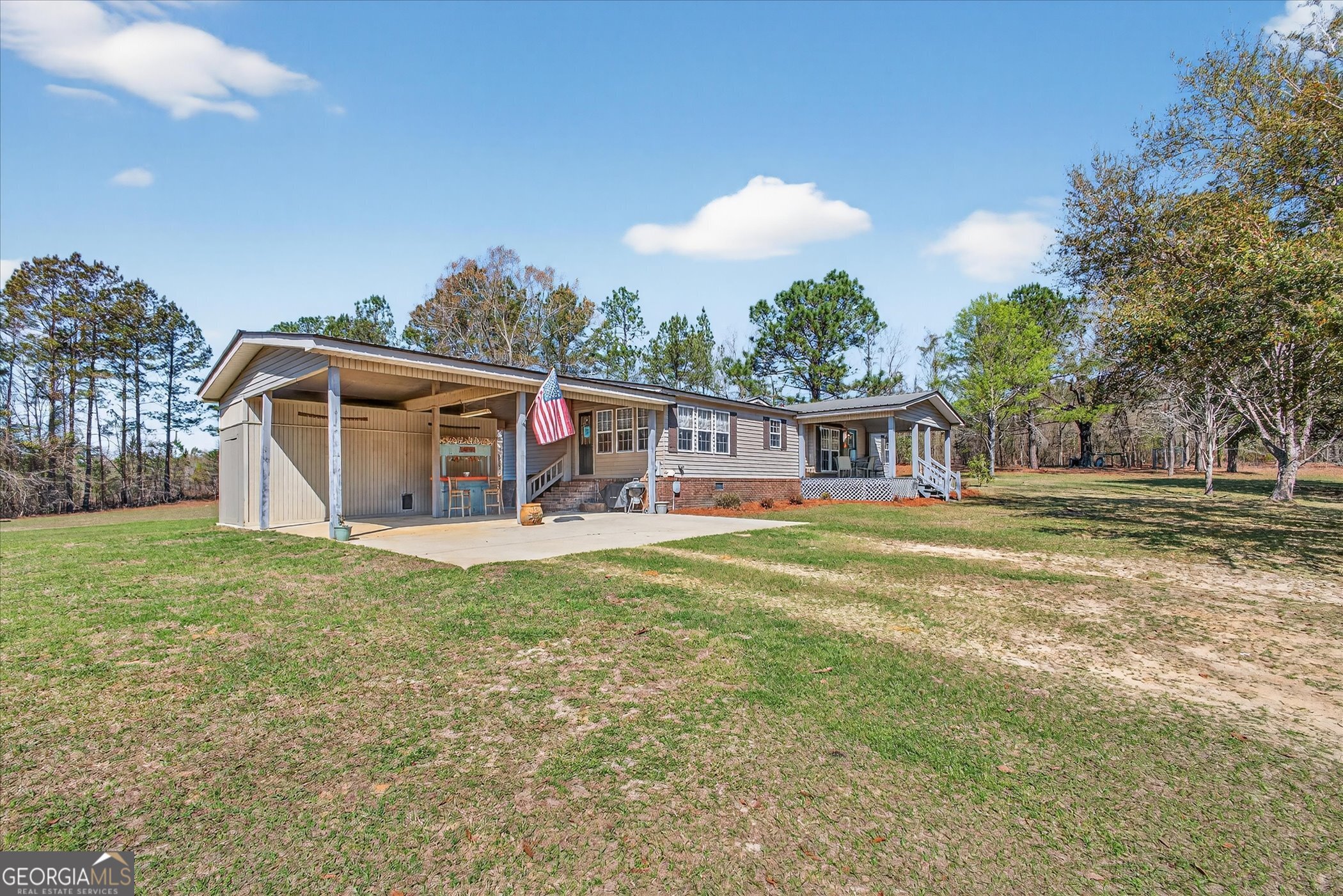 395 Winchester Road Sylvania, GA 30467 - Photo 3 of 60 a view of a house with a backyard and a patio