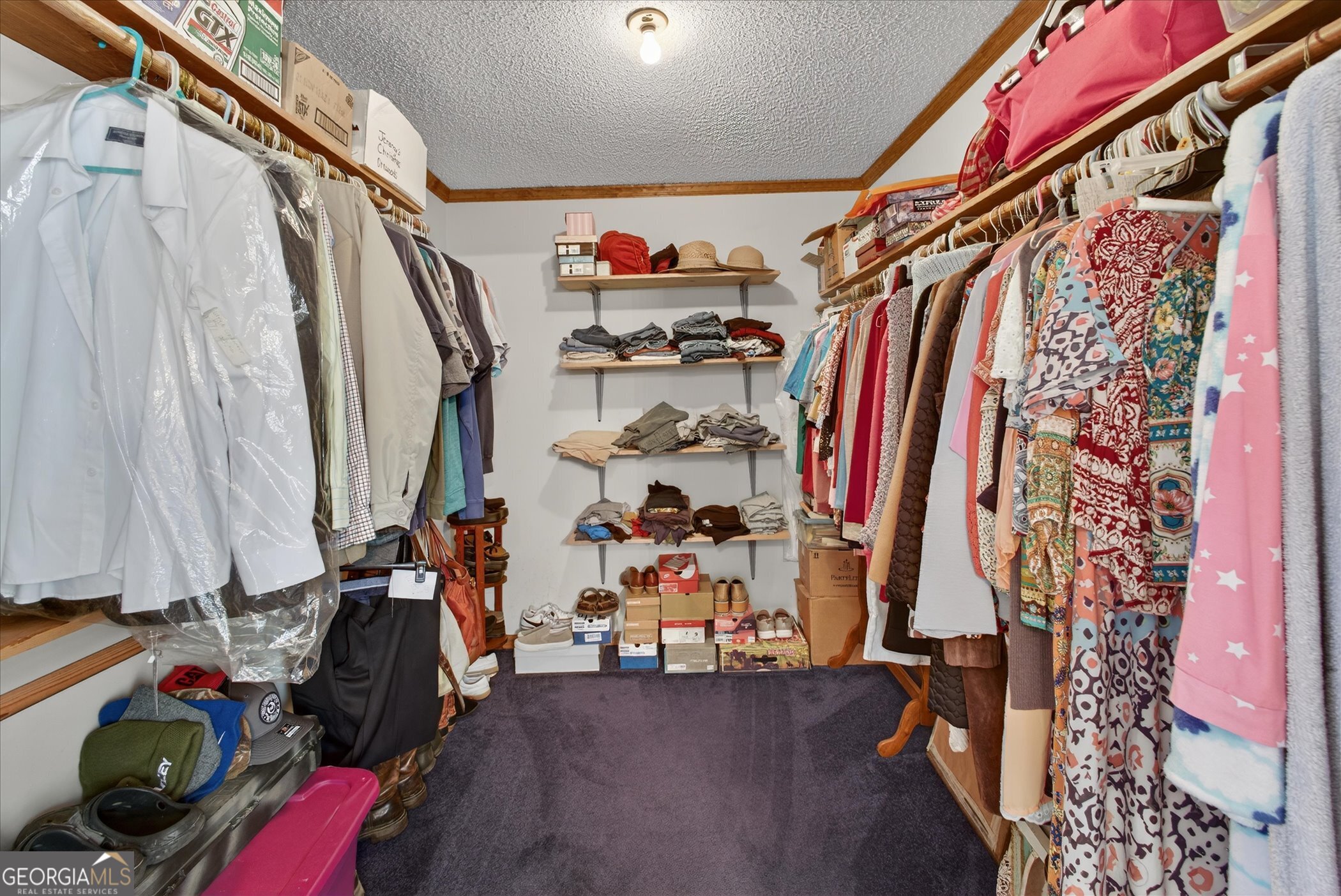 395 Winchester Road Sylvania, GA 30467 - Photo 34 of 60 a view of walk in closet with clothes