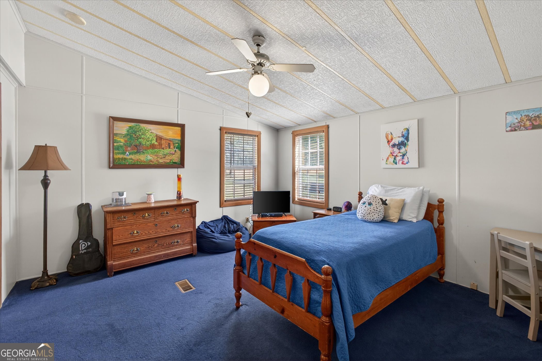 395 Winchester Road Sylvania, GA 30467 - Photo 35 of 60 a bedroom with a bed and a chandelier