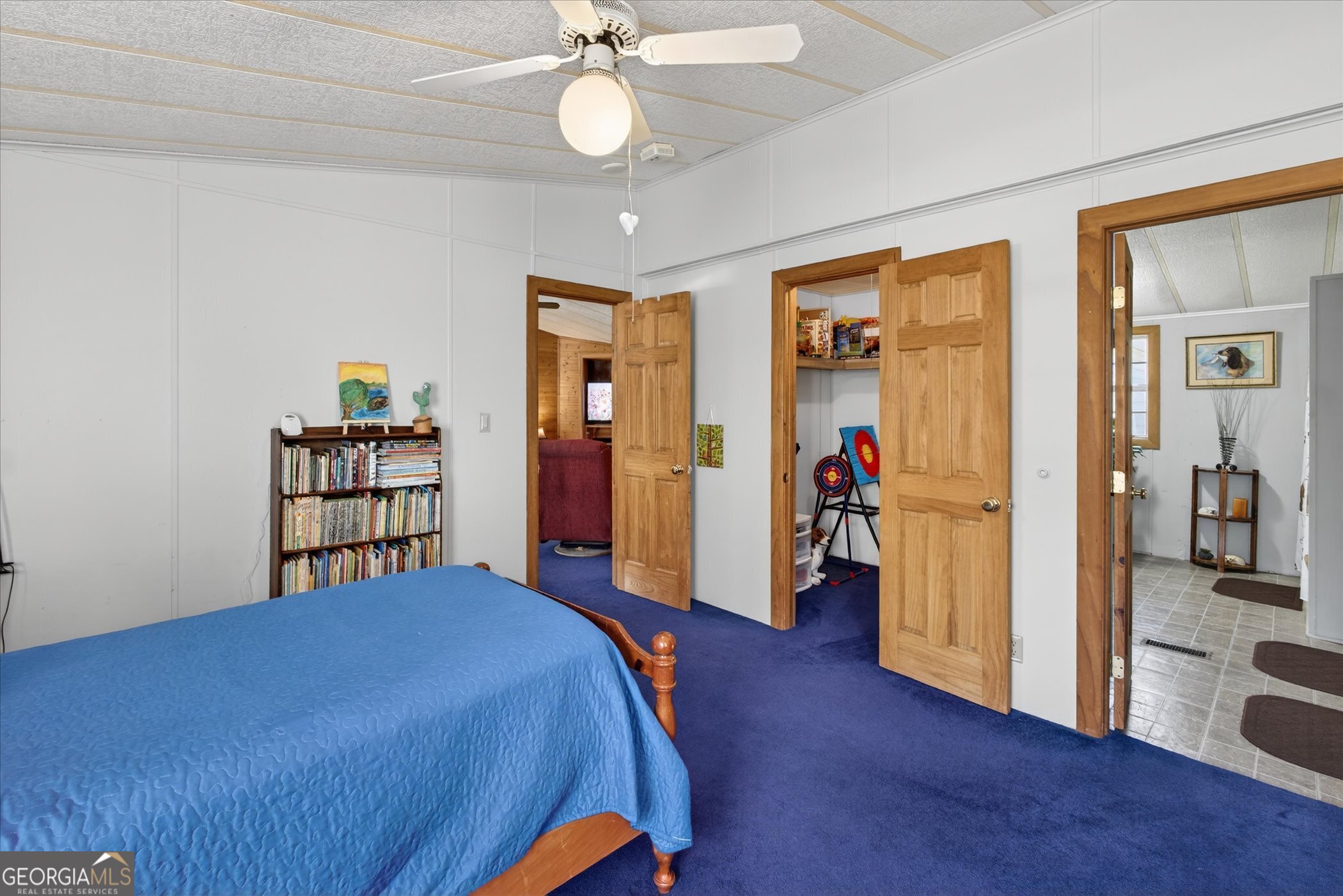 395 Winchester Road Sylvania, GA 30467 - Photo 36 of 60 a bed room with a bed and a chandelier