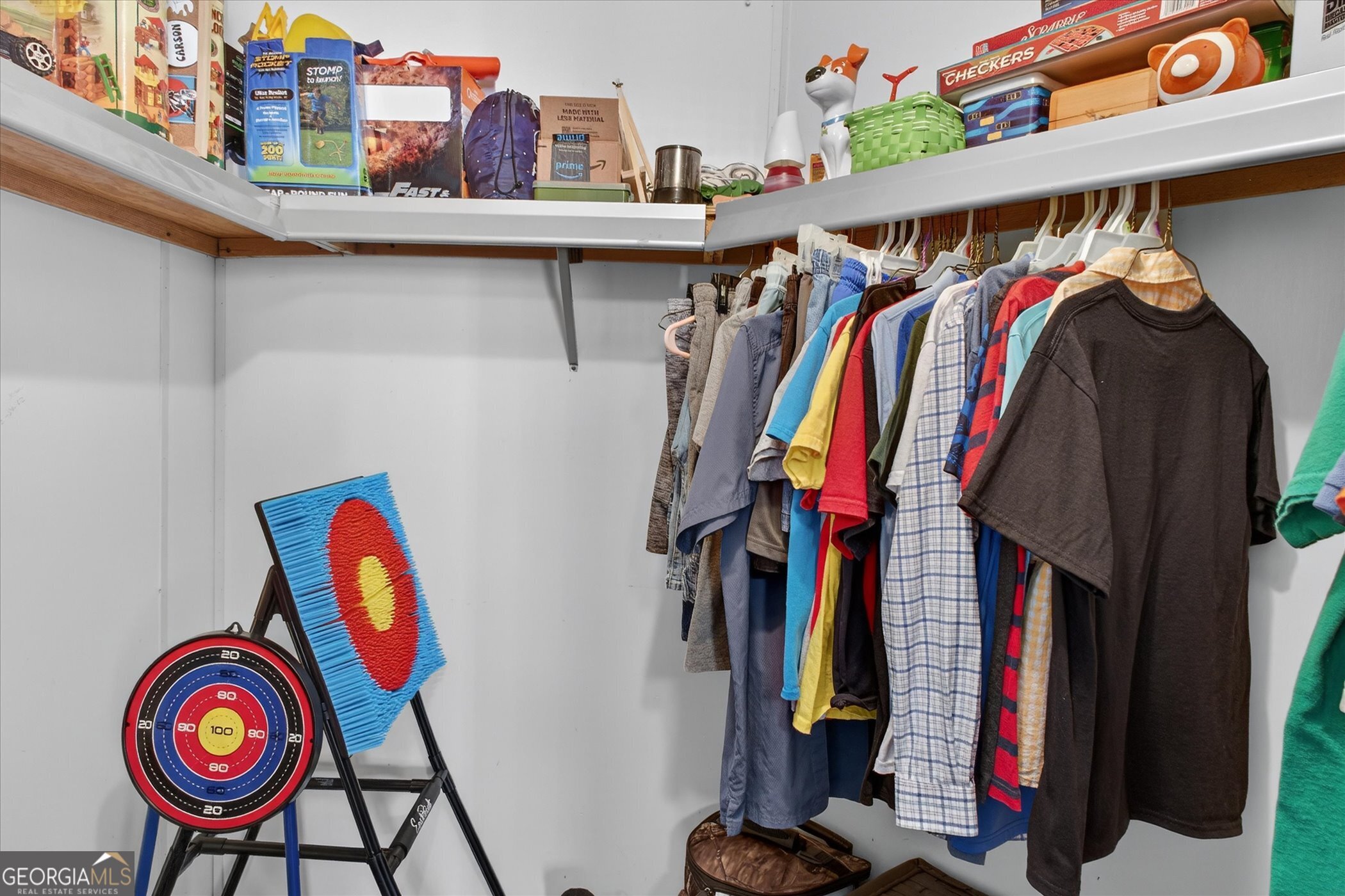 395 Winchester Road Sylvania, GA 30467 - Photo 37 of 60 a view of walk in closet with clothes and shoes