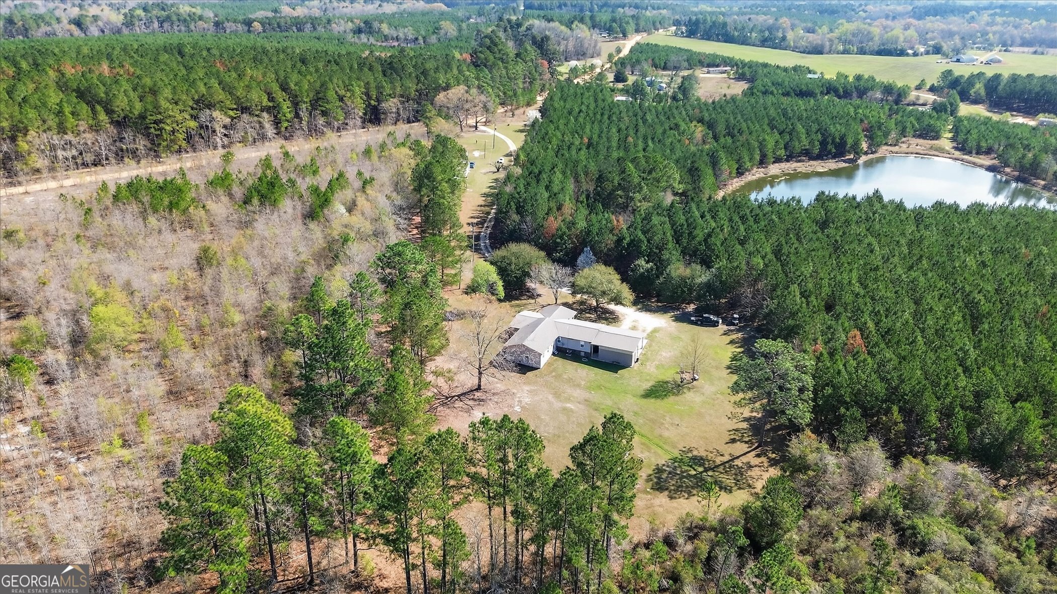 395 Winchester Road Sylvania, GA 30467 - Photo 56 of 60 a aerial view of a house with a yard and lake view
