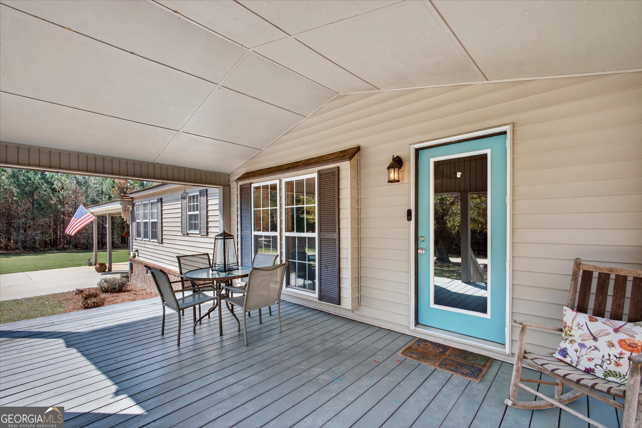 395 Winchester Road Sylvania, GA 30467 - Photo 6 of 60 a view of a patio with table and chairs and potted plants