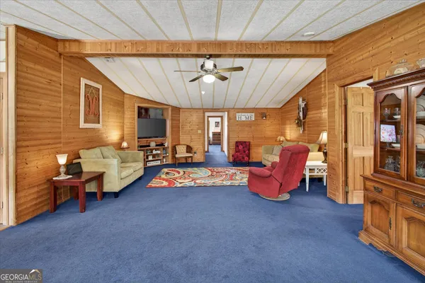 a bedroom with furniture and a chandelier