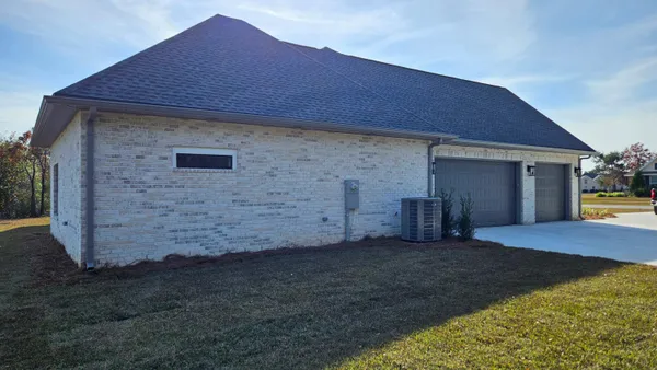 a kitchen with stainless steel appliances granite countertop a refrigerator and a stove