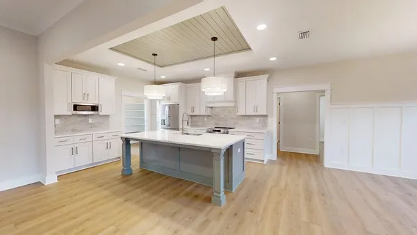 a bathroom with a double vanity sink and mirror