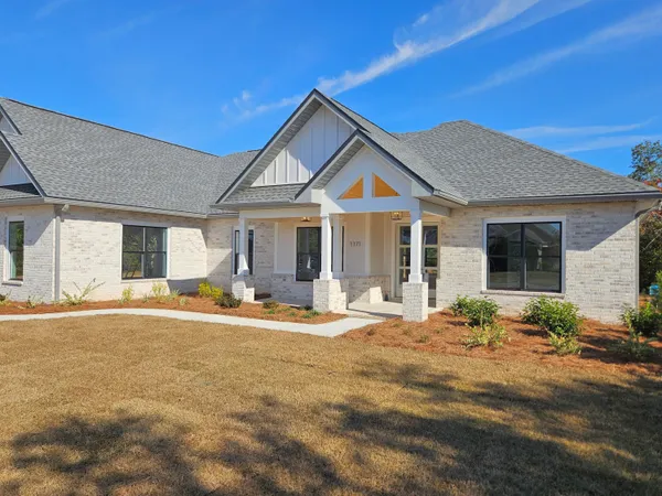 a front view of a house with glass windows