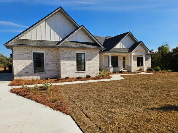 a open kitchen with cabinets and wooden floor