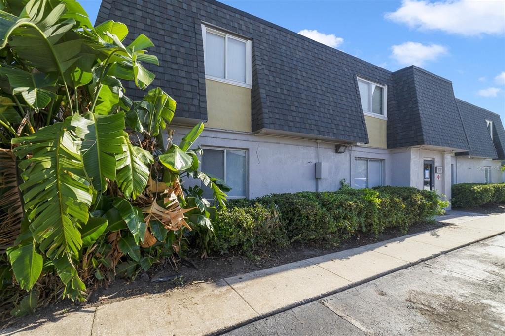 a view of a house with a garden