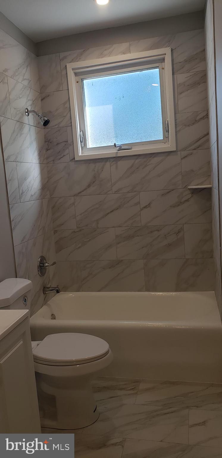 715 Collings Avenue, Unit A Oaklyn, NJ 08107 - Photo 12 of 22 a bathroom with a toilet and a shower