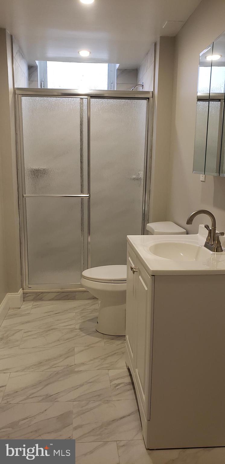 715 Collings Avenue, Unit A Oaklyn, NJ 08107 - Photo 18 of 22 a bathroom with a bathtub and a shower