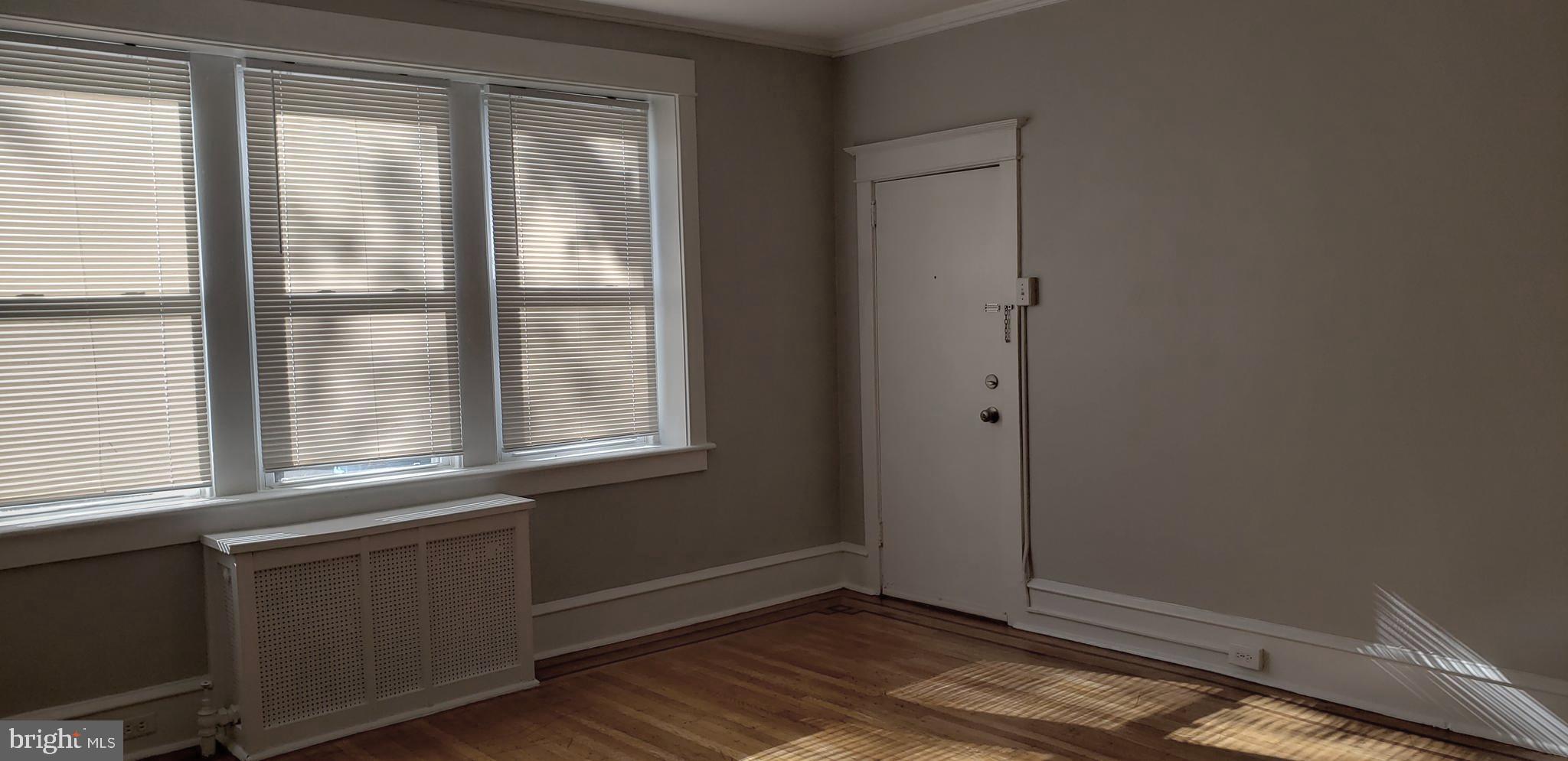 715 Collings Avenue, Unit A Oaklyn, NJ 08107 - Photo 2 of 22 a view of an empty room with a window