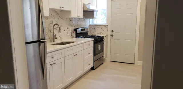 a view of kitchen with stainless steel appliances