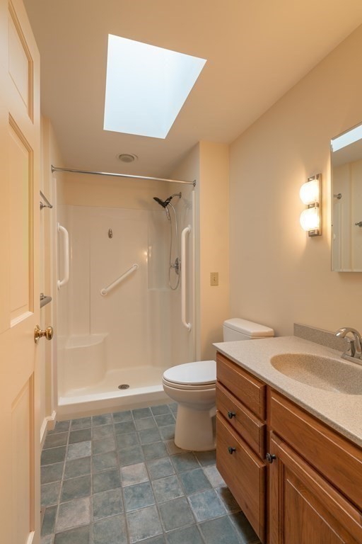 111 Audubon Road Northampton, MA 01053 - Photo 11 of 39 a bathroom with a sink a toilet and shower
