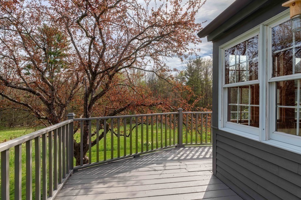 111 Audubon Road Northampton, MA 01053 - Photo 19 of 39 a view of a balcony with wooden floor and plants
