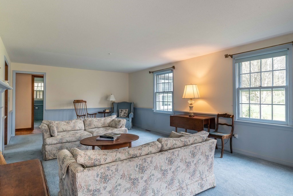 111 Audubon Road Northampton, MA 01053 - Photo 22 of 39 a living room with furniture and a fireplace