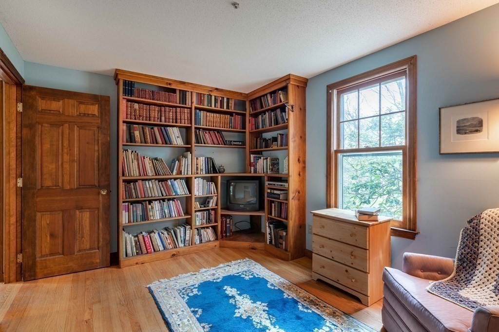 111 Audubon Road Northampton, MA 01053 - Photo 26 of 39 a living room with furniture and a book shelf