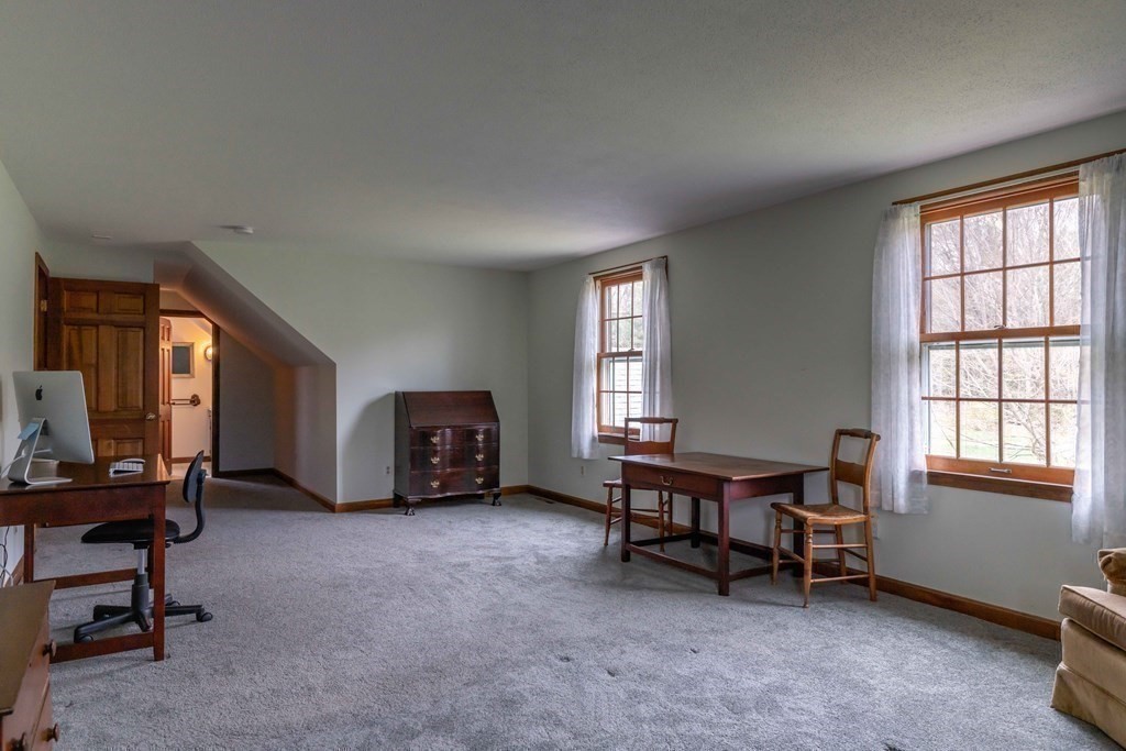 111 Audubon Road Northampton, MA 01053 - Photo 27 of 39 a living room with furniture and a window