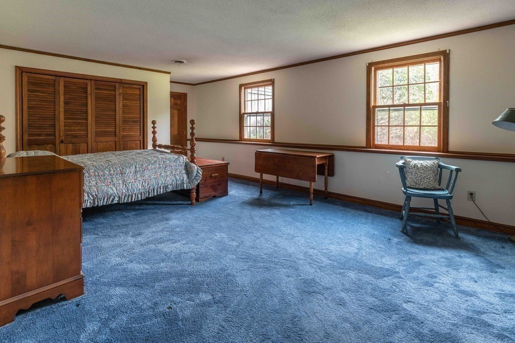 111 Audubon Road Northampton, MA 01053 - Photo 30 of 39 a bedroom with furniture and a window