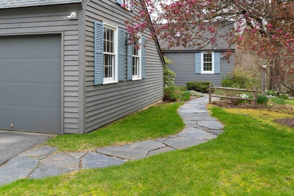 111 Audubon Road Northampton, MA 01053 - Photo 35 of 39 a view of a backyard with plants and large tree