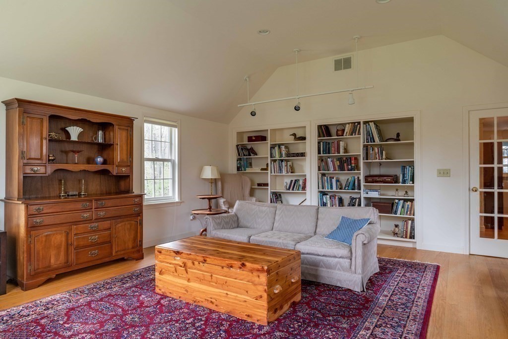 111 Audubon Road Northampton, MA 01053 - Photo 9 of 39 a living room with furniture and a bookshelf